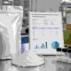 Wholesale lumbrokinase powder supplier scene with bulk pouch, COA document, sample vials, and shipping cartons