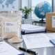 Earthworm peptide powder with export documents, COA, specification sheet, customs paperwork, and shipping carton