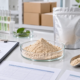 Earthworm peptide powder sample with blank specification sheets, test tubes, sealed pouch, scoop, and quality review documents