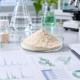 Earthworm peptide powder sample with laboratory research documents, peptide profile charts, and quality review materials