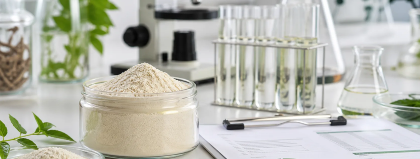 Lumbrokinase powder natural enzyme ingredient sample with laboratory testing glassware and quality documents