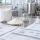 Lumbrokinase powder sample with OEM supplement manufacturing documents, quality checklist, and production planning materials