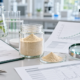 Lumbrokinase powder sample with supplier QA checklist, COA documents, and ingredient review materials
