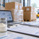 Lumbrokinase powder import planning desk with sample jars, shipping documents, sealed cartons, and warehouse handoff area