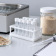 Conceptual digestion-research bench with a generic water bath, capped clear sample tubes, unbranded powder jar, micropipette, and blank notebook