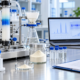 Lumbrokinase purification and quality control lab bench with chromatography equipment, sample vials, powder sample, and batch documents