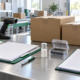 Conceptual exporter verification desk with closed cartons, sample vial, protective case, barcode scanner, lot-record folder, and packing clipboard